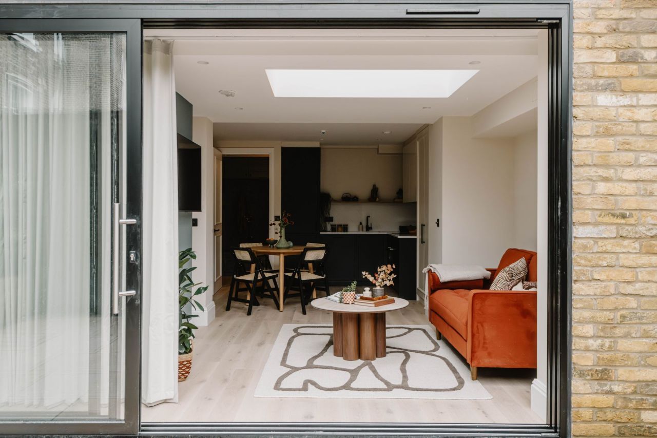 Garden studio extension interior with skylight and modern furnishings