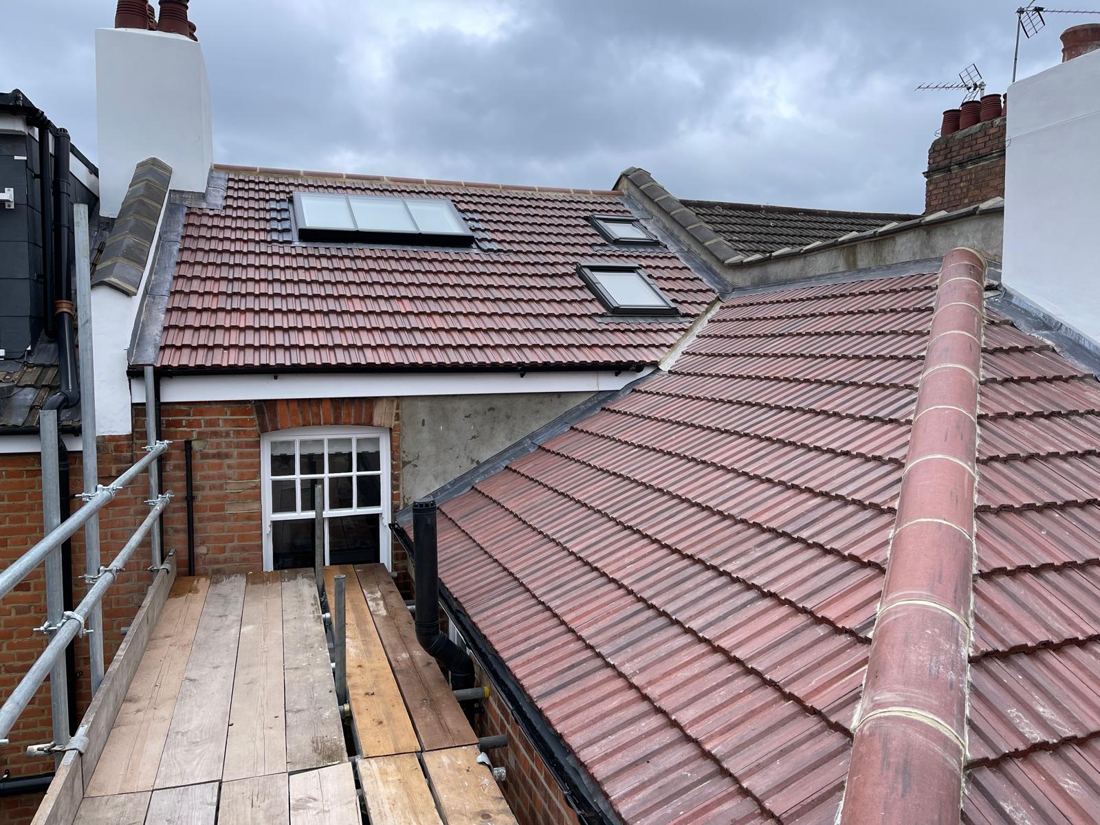 Rear dormer loft conversion with skylights on a London terrace