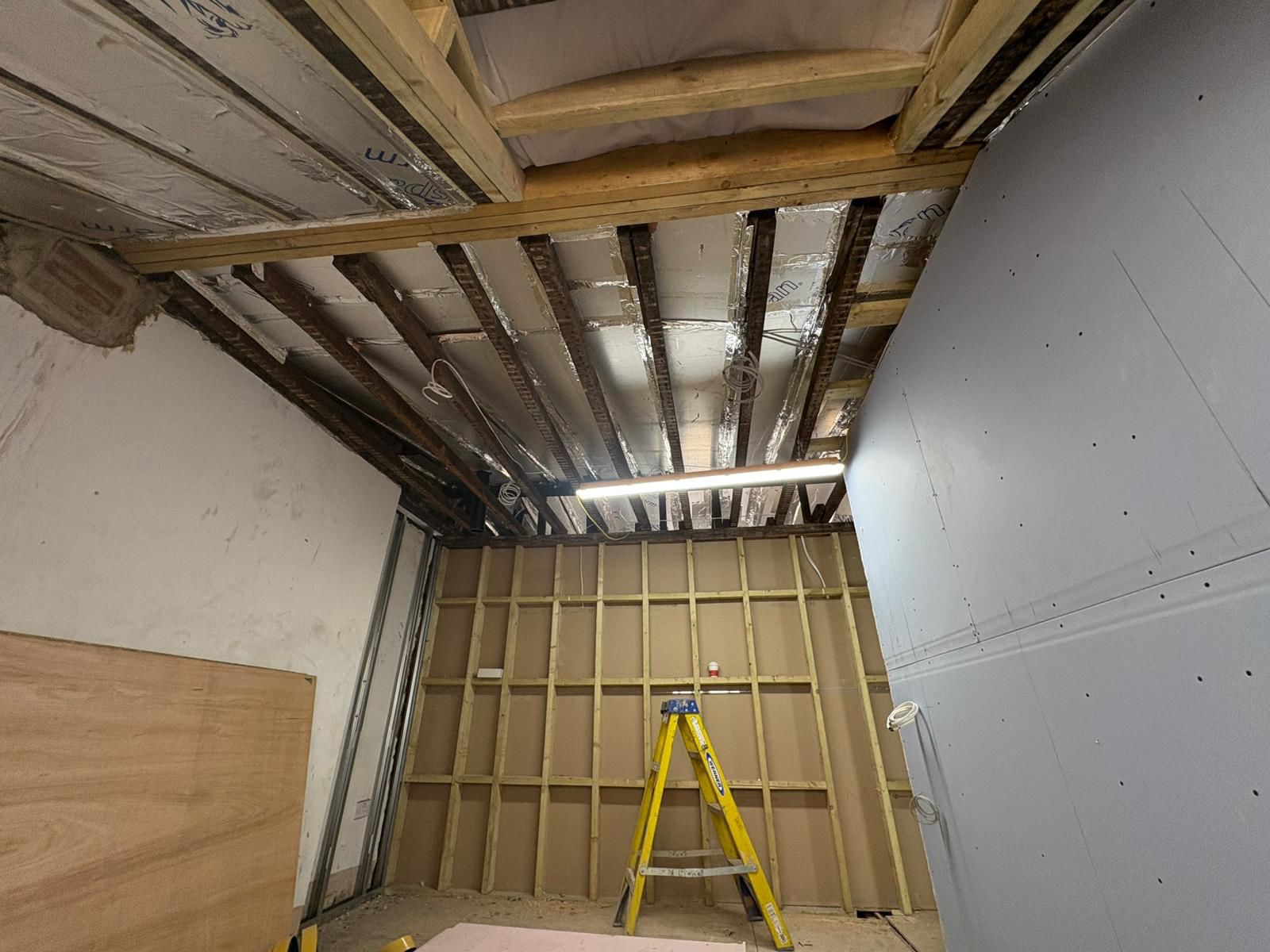 First-fix joinery and insulated ceiling structure during full refurbishment
