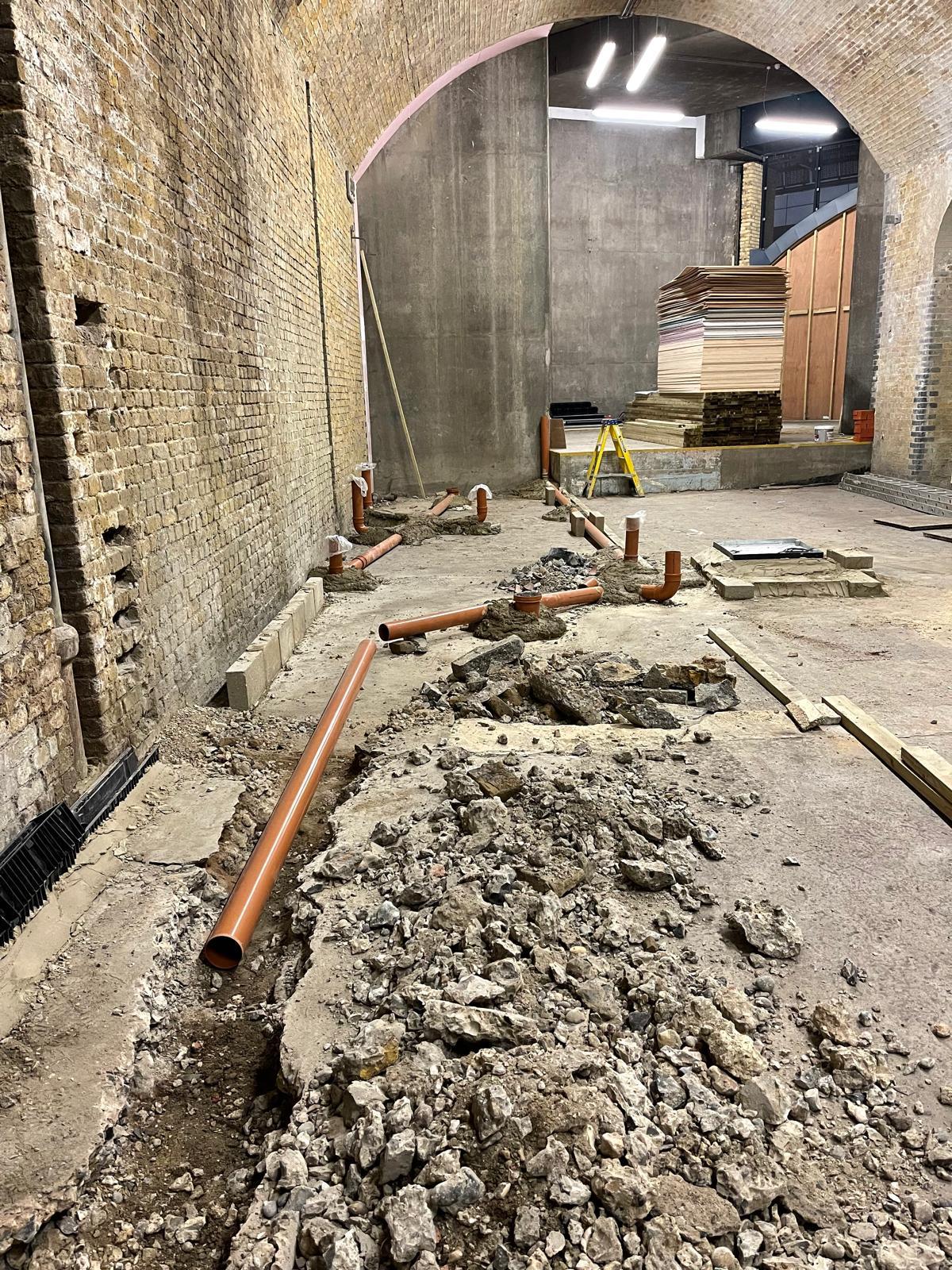 Below-ground drainage first-fix in railway arch commercial unit